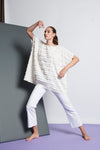 A white easy fit, square cut top made from cotton and linen with round neckline, short sleeves, and striped fringe fabric