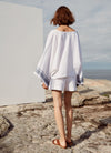 An easy fit, square cut, v-neck top with long sleeves made from yarn dye stripe washed linen in white with indigo stripe
