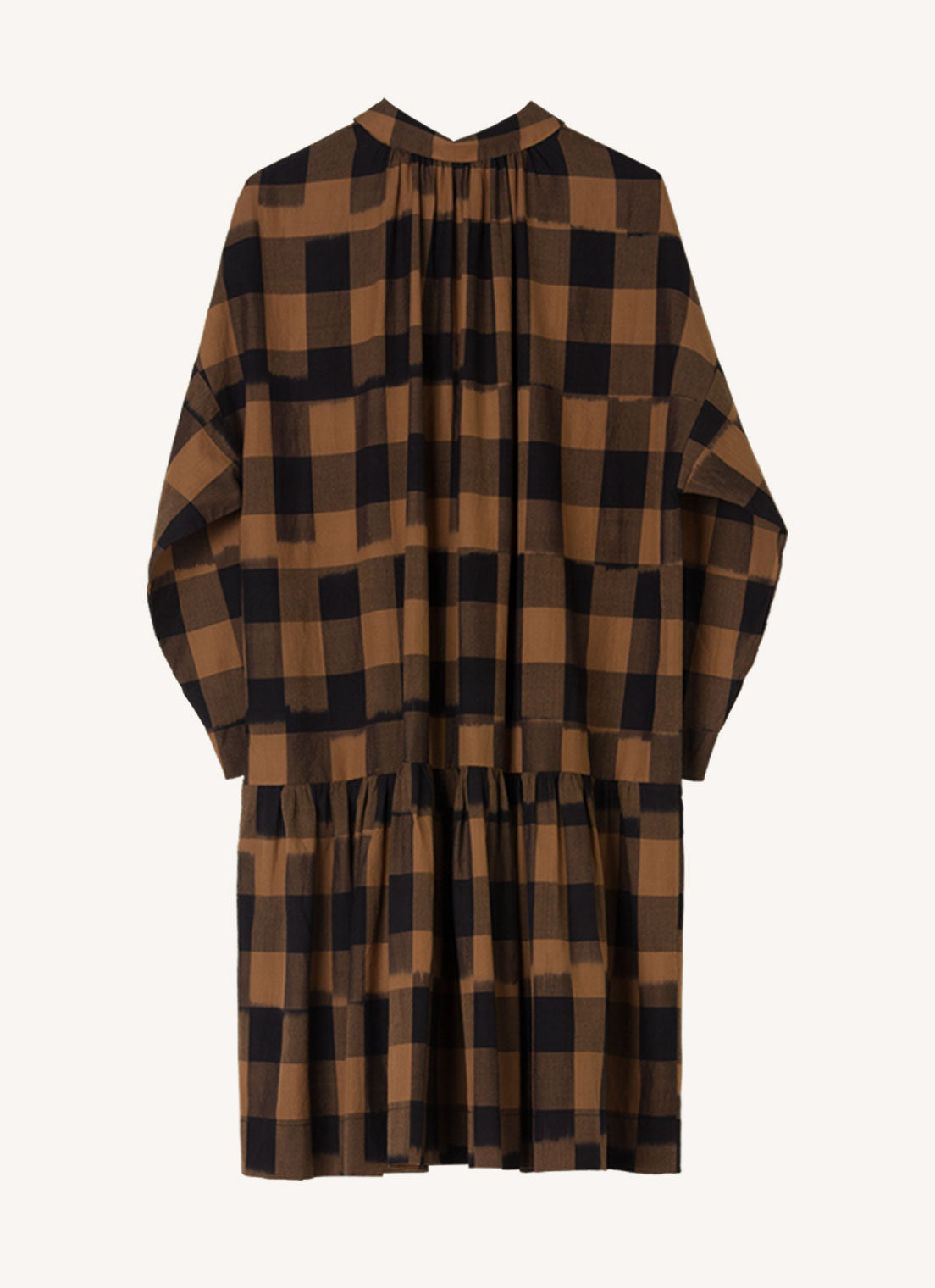 A bronze plaid, knee-length dress with centre front button fastening, collared neckline and gathered details from the hip made from handwoven ikat cotton