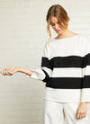 A black and white stripe boatneck jumper with relaxed fit and long sleeves made from merino wool