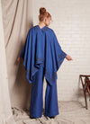 A one size, easy fit, blue embroidered cape shawl made from European pure linen