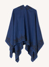 A one size, easy fit, blue embroidered cape shawl made from European pure linen