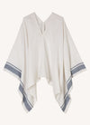 An easy fit, square cut, v-neck poncho with long sleeves made from yarn dye stripe washed linen in white with indigo stripe
