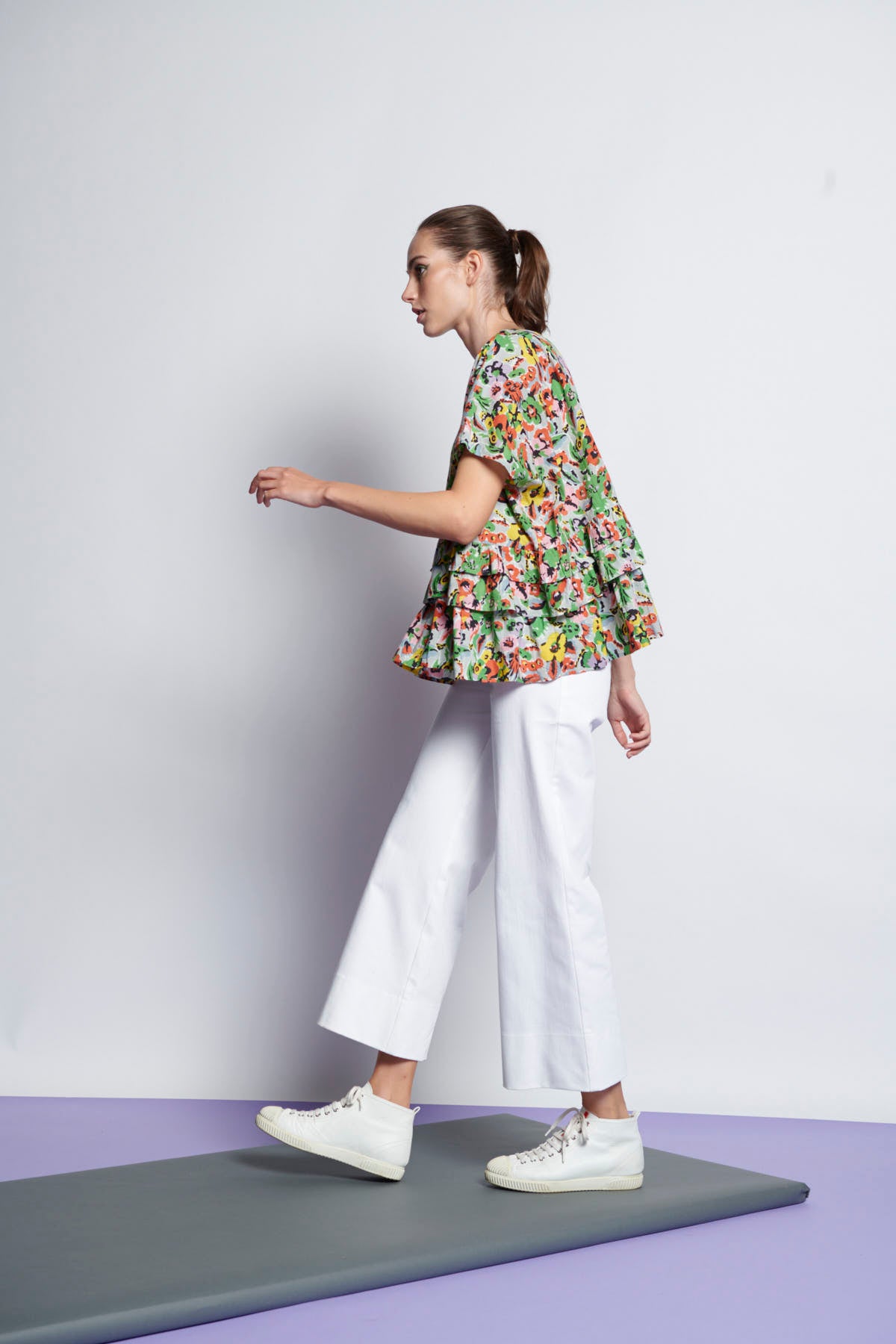 An easy-fit, tiered ruffle cotton top with round neckline and short sleeves and floral print