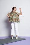 An easy-fit, tiered ruffle cotton top with round neckline and short sleeves and floral print