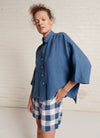 An indigo and white gingham shorts with elasticated waistband and pockets made from large gingham yarn dye washed linen