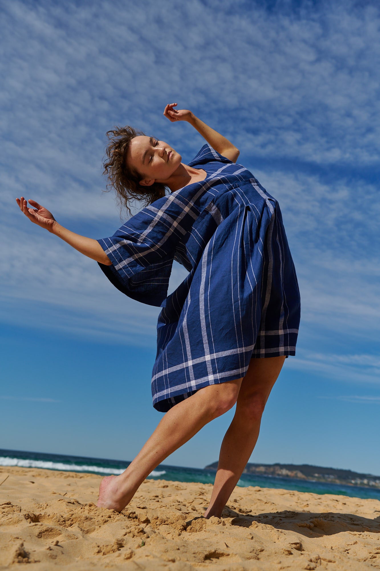 An indigo plaid, one size, easy fit linen dress with kimono-style sleeves and round neckline