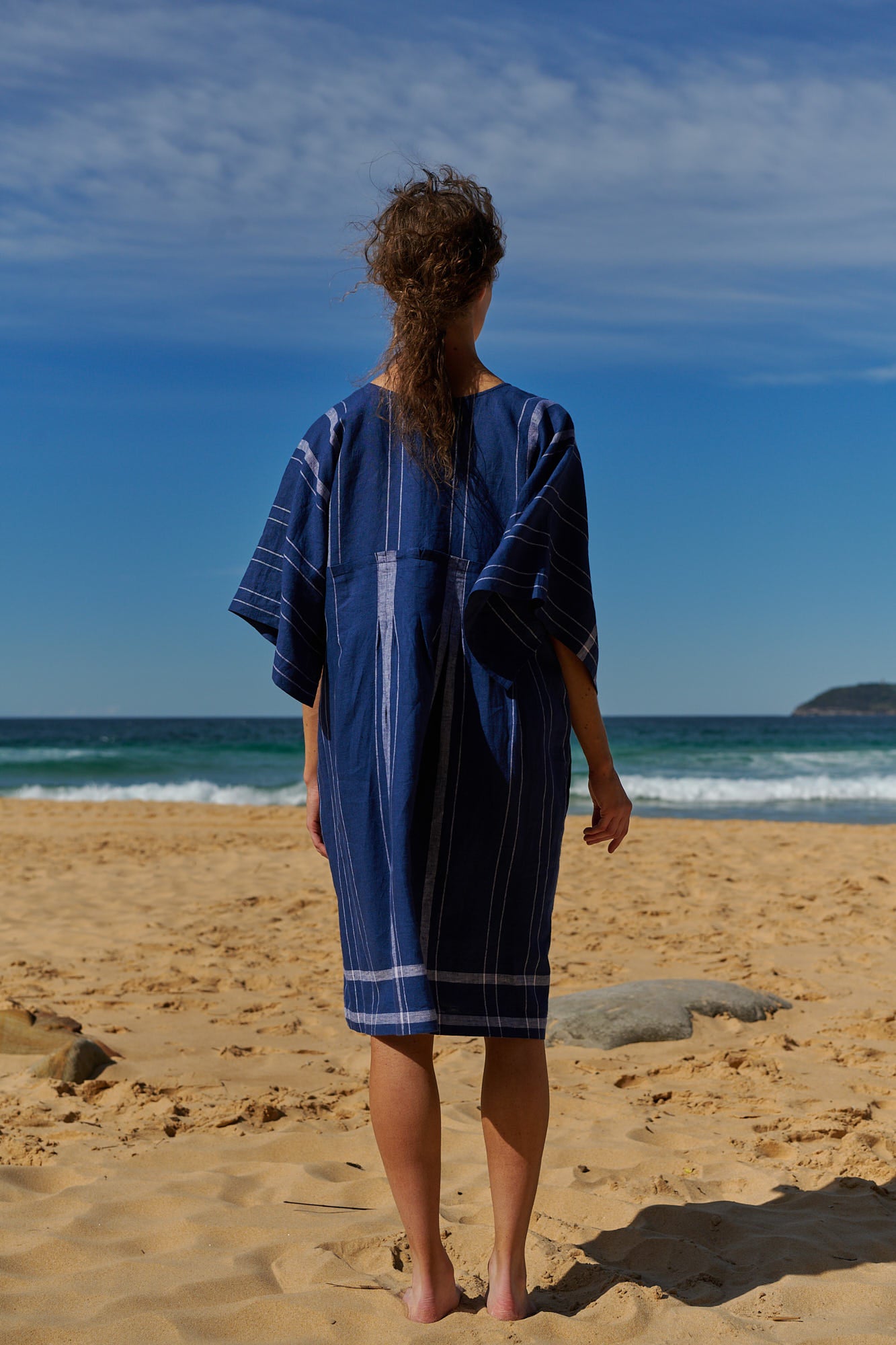An indigo plaid, one size, easy fit linen dress with kimono-style sleeves and round neckline