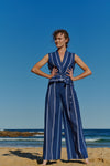 An indigo plaid, sleeveless, wrap linen top with V neckline and front tie belt 