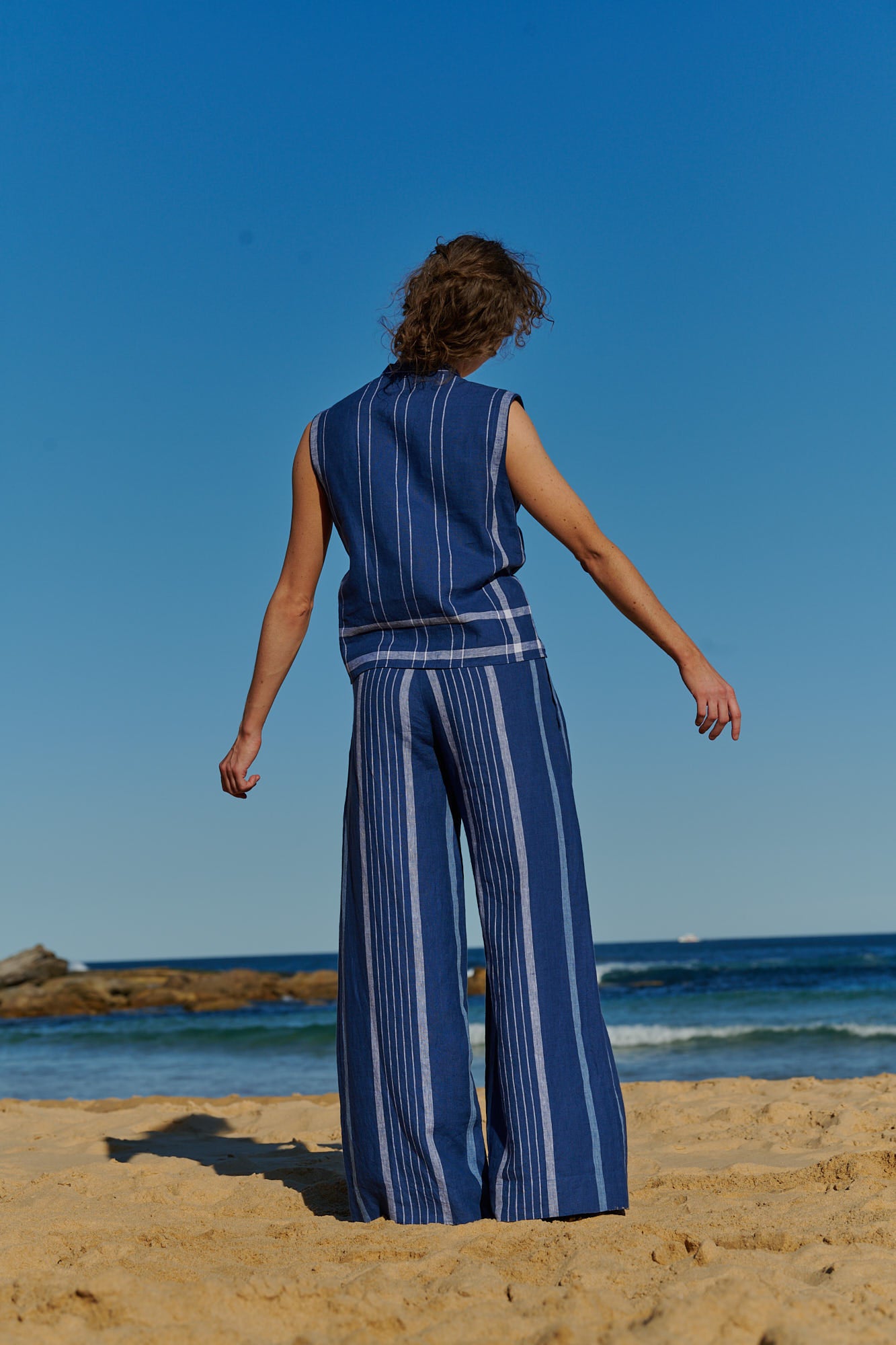 An indigo stripe linen tailored pants with pockets