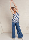 An indigo, wide-leg pants with wide and elasticated back waistband and side pockets in yarn dye washed linen