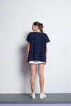 A navy blue easy fit, square cut top made from cotton and linen with round neckline, short sleeves, and striped fringe fabric 