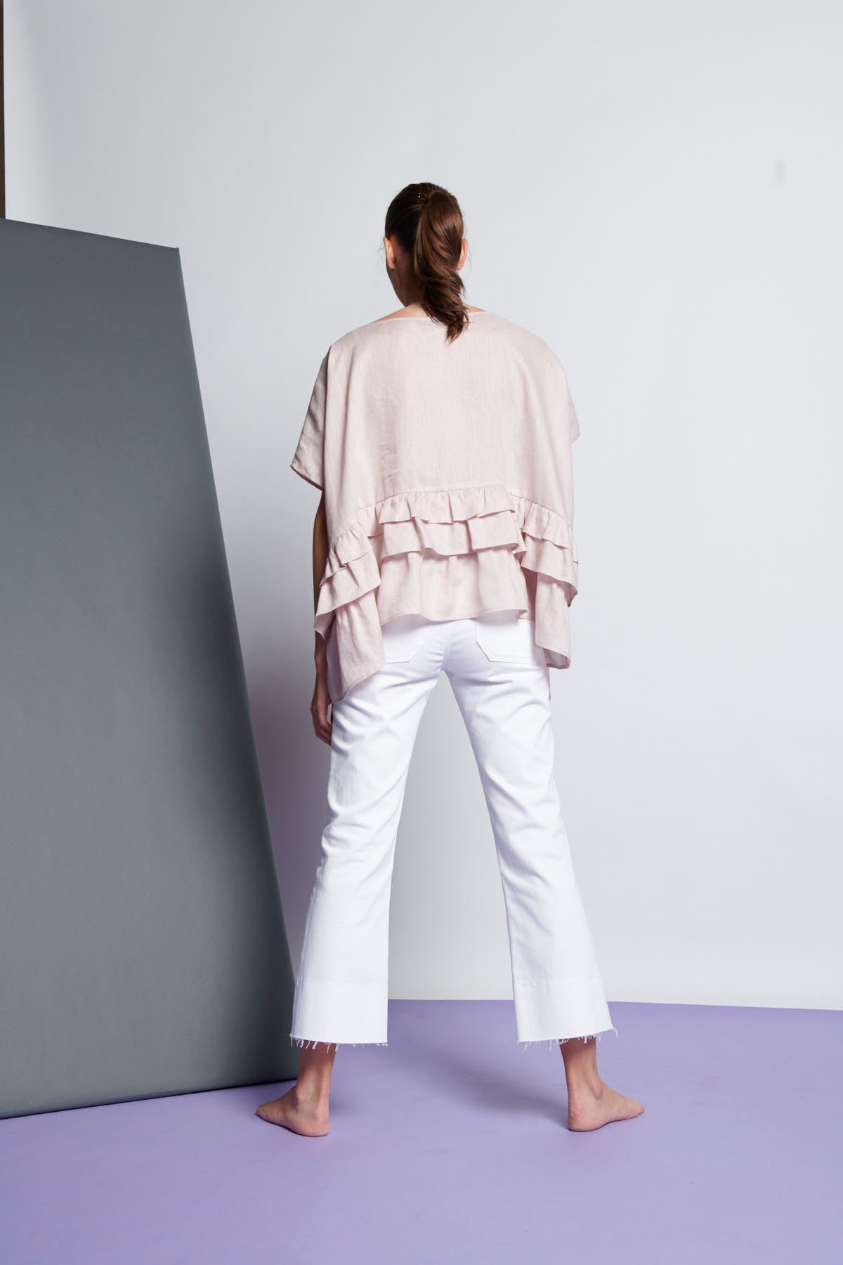 An easy-fit, tiered ruffle linen top with round neckline and short sleeves in very pale pink