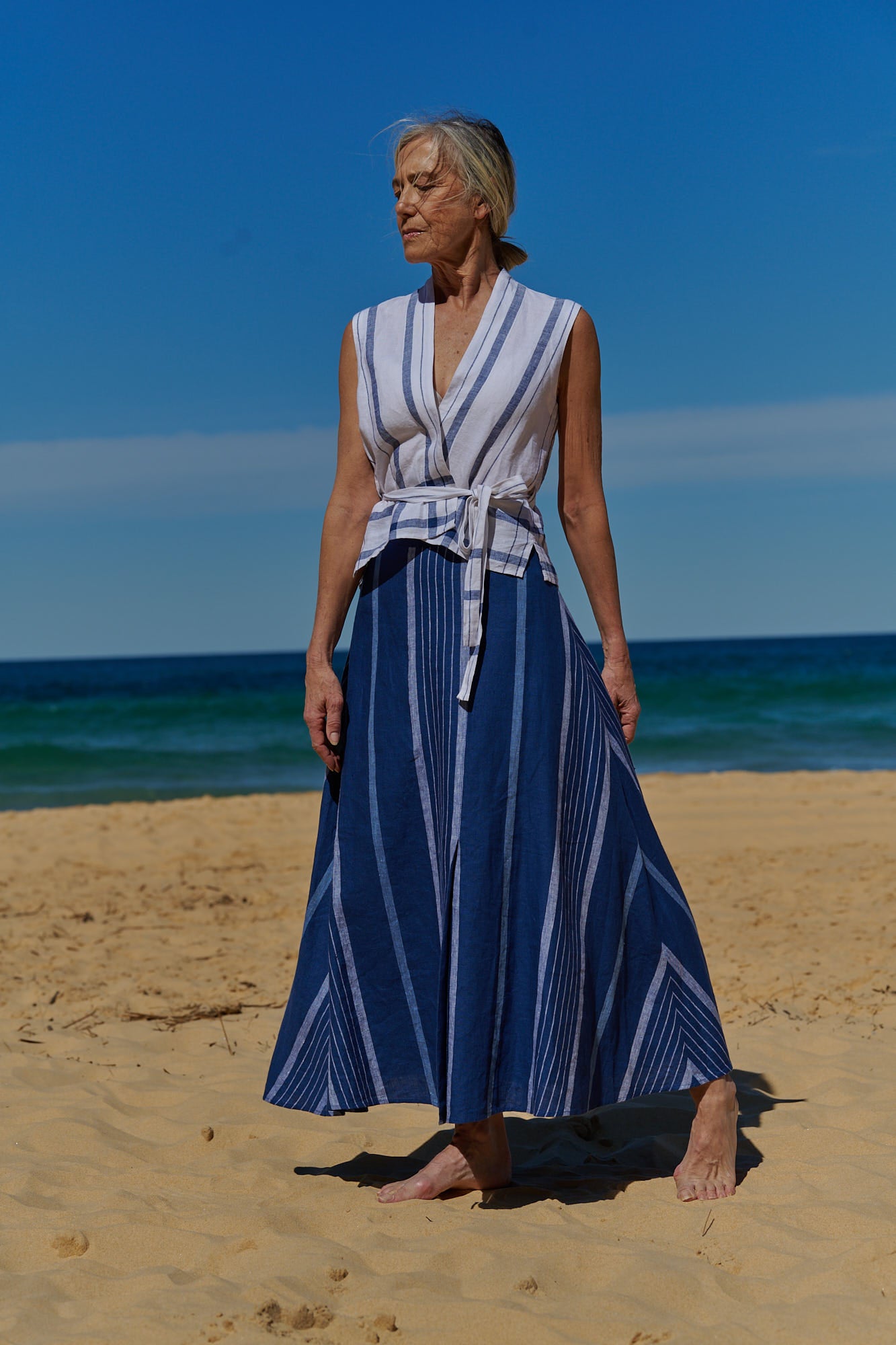 An indigo stripe linen, A-Line, maxi skirt with side pockets and front slit