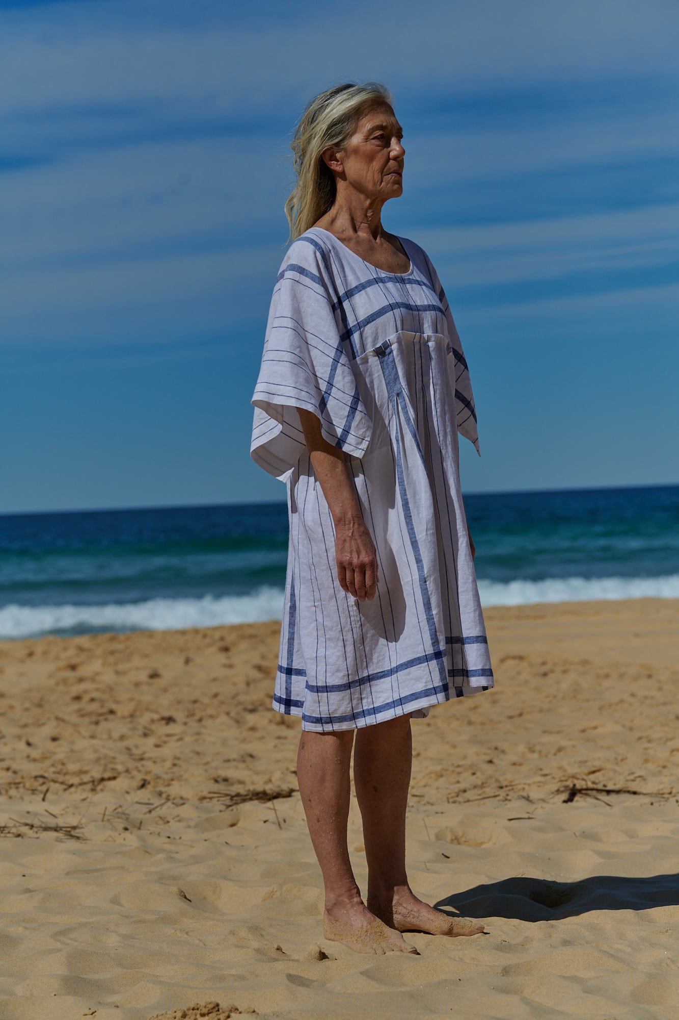A white plaid, one size, easy fit linen dress with kimono-style sleeves and round neckline