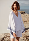 An easy fit, square cut, v-neck top with long sleeves made from yarn dye stripe washed linen in white with indigo stripe